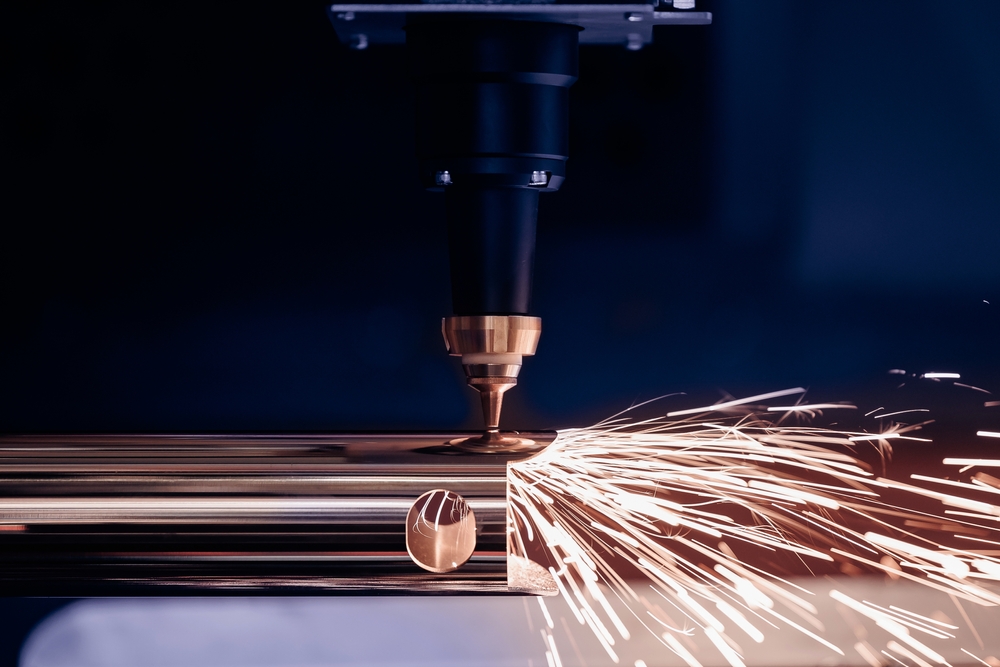 Closeup of a laser cutting steel tubing